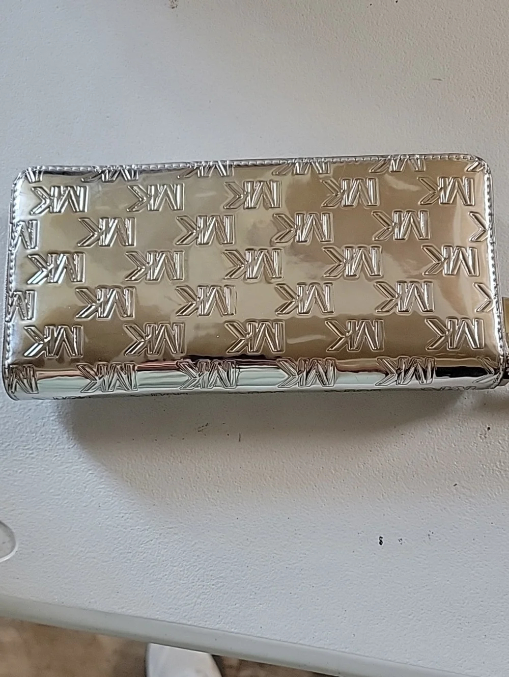 Michael Kors Jet Set Large Patent Logo Embossed Continental Wallet In Silver